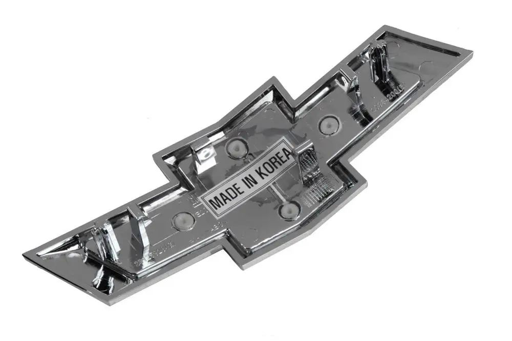 23125928 Emblema Delantero -moño- Cruze B 20/ Lt