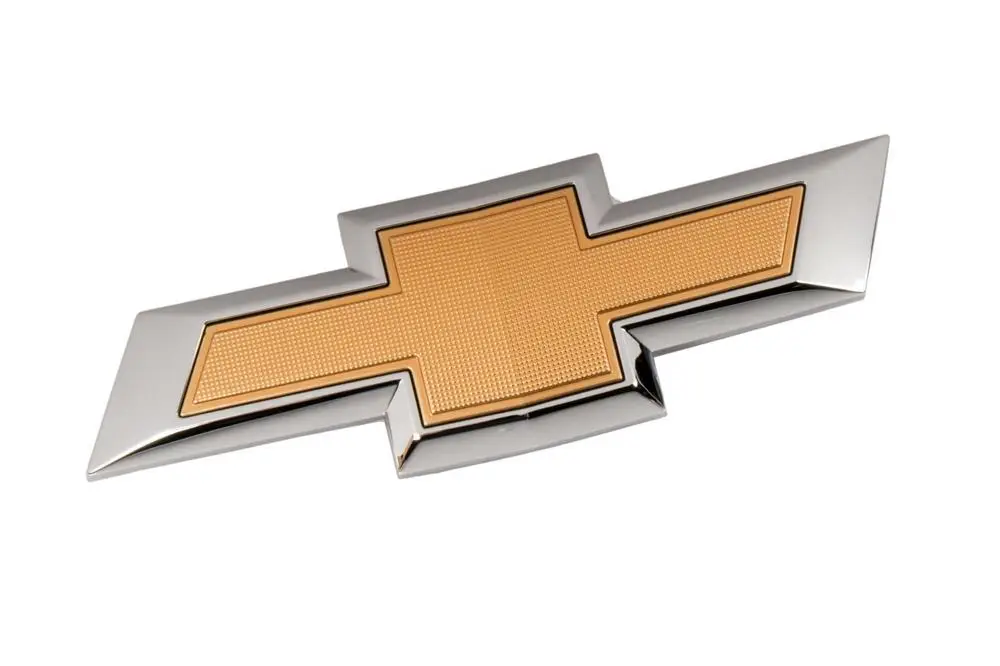 23125928 Emblema Delantero -moño- Cruze B 20/ Lt
